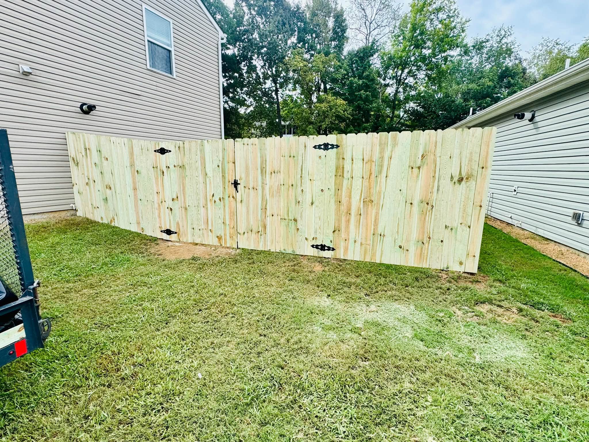 Wood privacy fence with gates built by Athens Fence Company